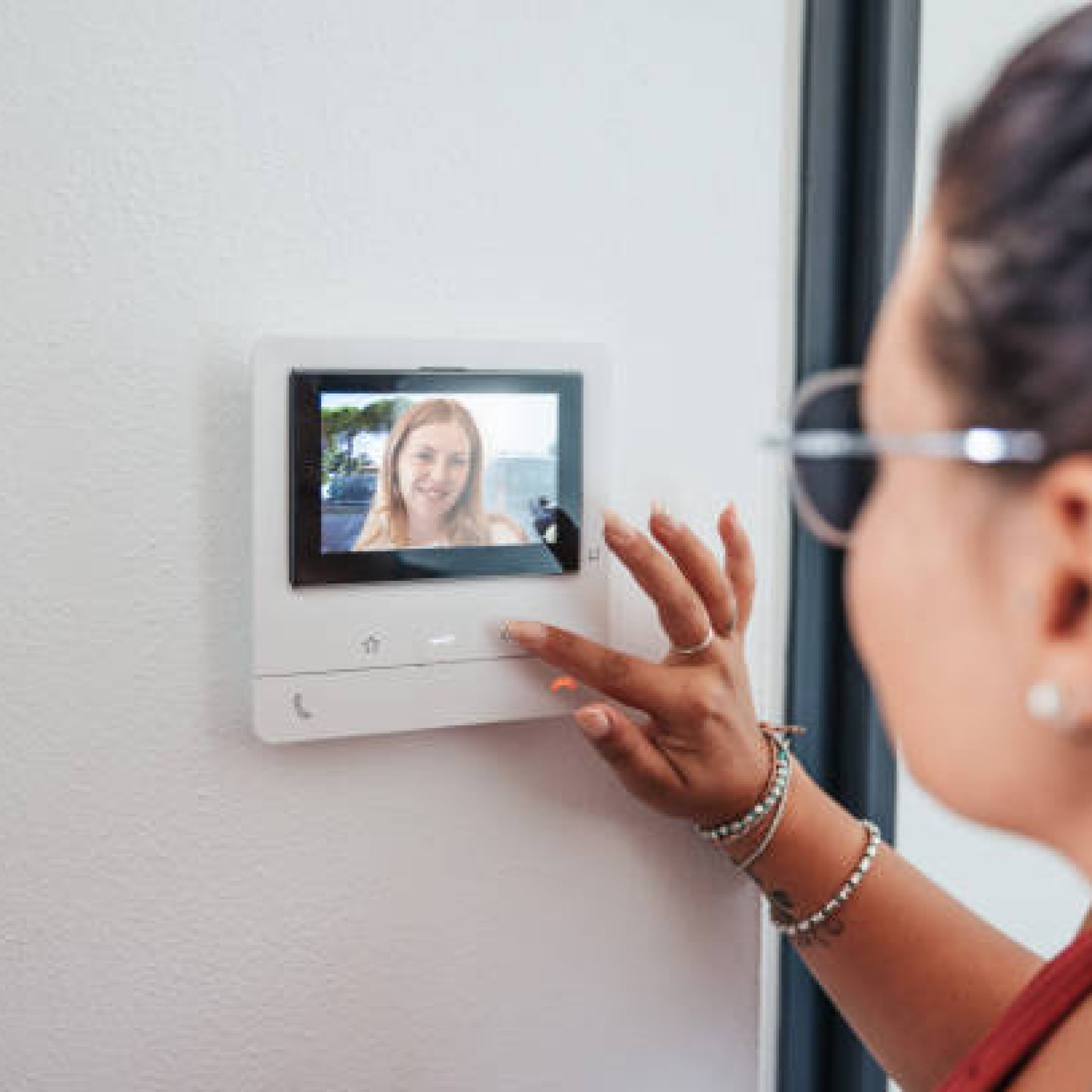 Video intercom displays a friend at the door.